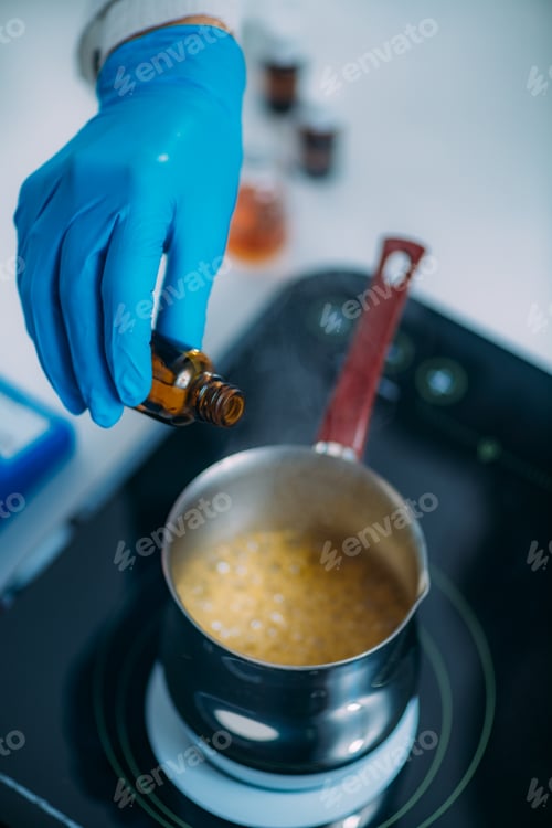 Preview: Woman Preparing Beauty Cream with Essential Oil Extracts