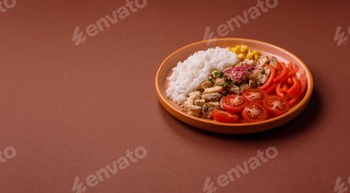 Preview: Bowl with chicken pieces, rice, tomatoes, peppers and microgreens. Bowl with chicken