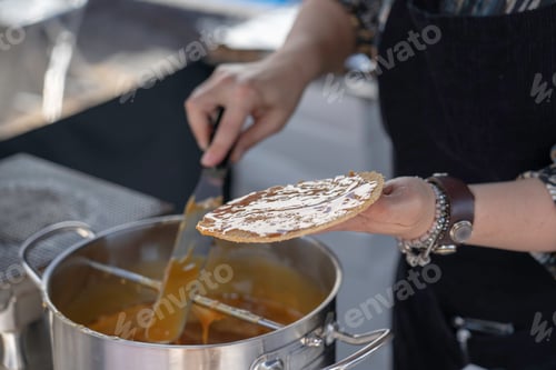 Preview: Lady at local markets making stroopwafel/ dutch waffles with syrup