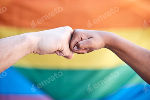 Preview: Shot of two protestors bumping fists in support at a LGBTQ protest