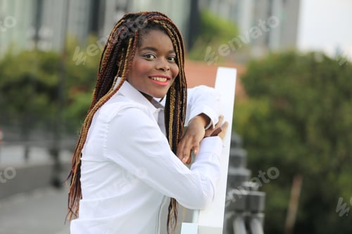 Preview: Portrait of a beautiful black skin woman with Afro hair on street, diverse people of color from arou