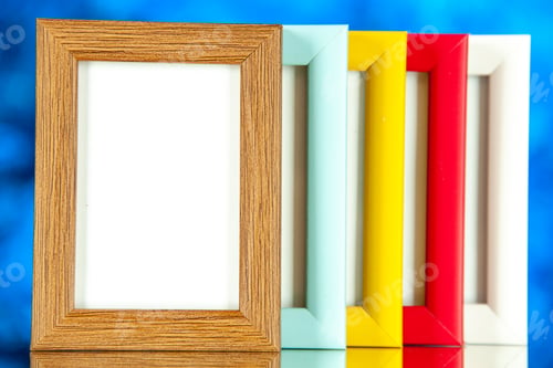 Preview: front view different picture frames with colored corners on blue background color picture shoot