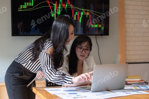 Preview: Business people meeting in office and discussing over a documents, two woman with a financial report