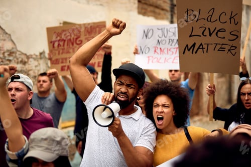Preview: African American couple among crowd on people on Black Lives Matter protest.