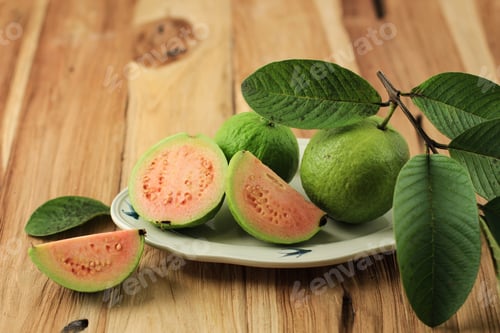 Preview: Closeup of a Pink Red Guava Cut in Half, Fresh Picked,