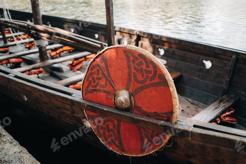 Preview: An antique Viking ship on the river. Old boat