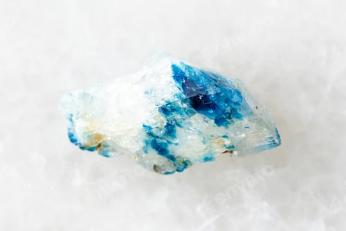 Preview: sample of raw euclase crystal on white marble