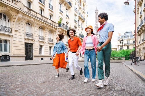 Preview: Group of young happy friends visiting Paris and Eiffel Tower
