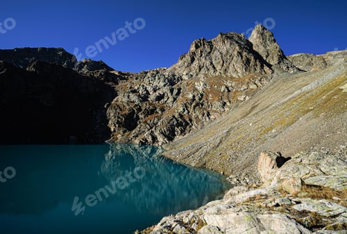 Preview: Mountain lake in a rocky area in the mountains