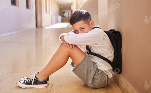 Preview: School child, bullying and sad student on ground for depression, anxiety and autism or learning pro