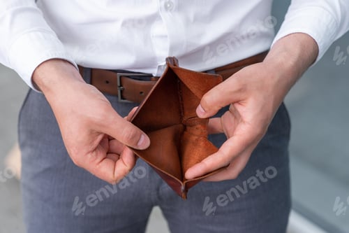 Preview: A fired employee due to the crisis opens showing his empty wallet.