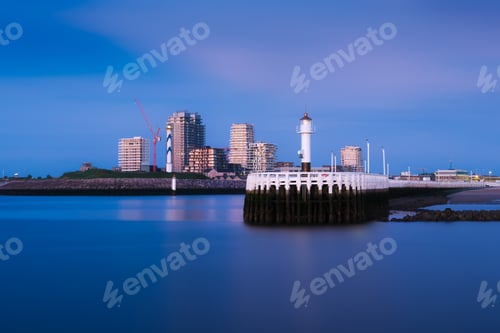 Preview: Ostend, Belgium. Panoramic view of the bay during sunset. Pier and lighthouse in the bay.