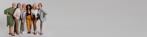 Preview: Multi-ethnic group of happy mature women bonding against grey background