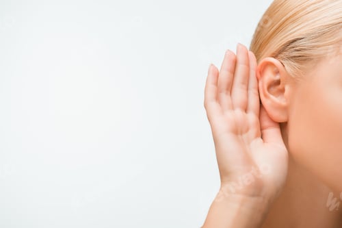 Preview: cropped view of blonde woman touching ear while listening isolated on white