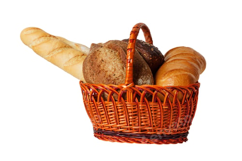 Preview: Wicker basket with assorted baking products isolated on white background