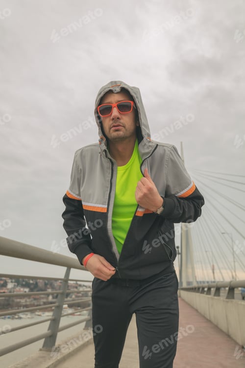 Preview: Man Preparing For Exercise On A Big Bridge.