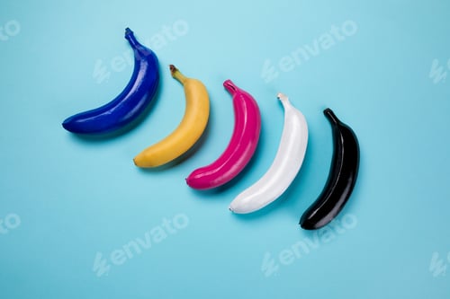 Preview: Top view of colorful bananas collection isolated on blue