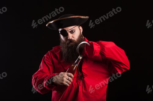 Preview: Portrait of a medieval bearded pirate opening a bottle with his hand hook for halloween