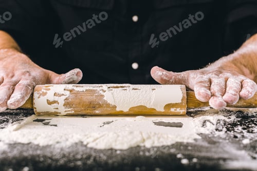 Preview: Hands baking dough with rolling pin