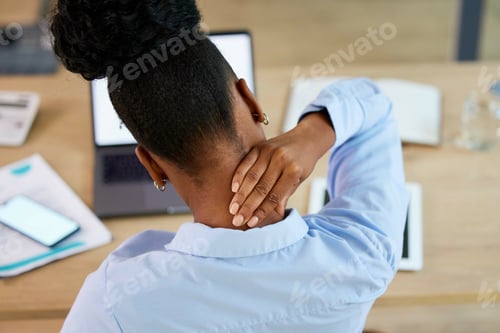 Preview: Black woman, neck pain and fatigue at office desk stretching or massage while tired or burnout. Ana