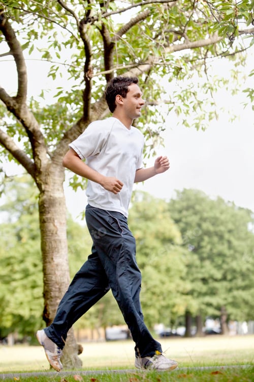 Preview: Fit Man Jogging Outdoors At The Park