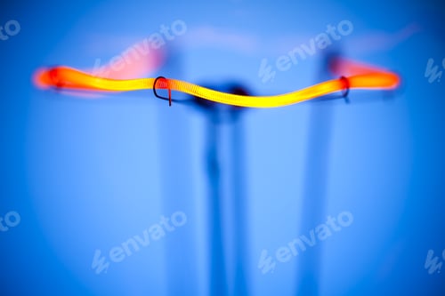 Preview: Close-up of burning light bulb with tungsten filament in center