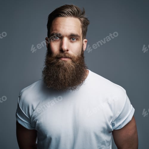 Preview: Serious young muscular man with large fuzzy beard