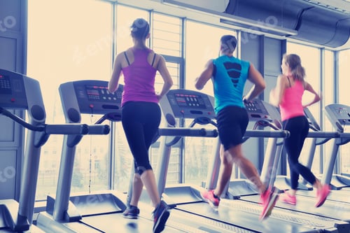Preview: Group of people running on treadmills