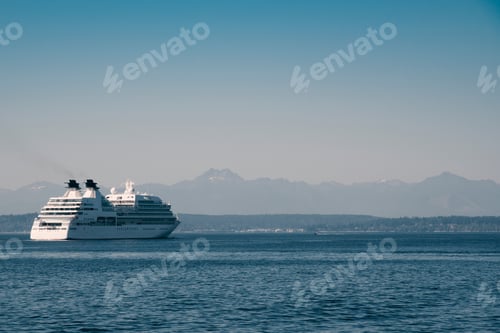 Preview: Cruise ship leaving Seattle on Puget sound under the Olympic mountain range.