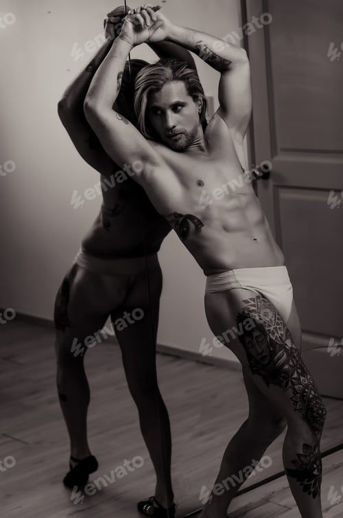 Preview: White Latin model of Venezuelan man posing for portrait, shirtless fitness body in front of mirror