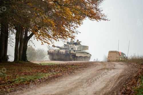 Preview: Military tank and soldiers with guns on a field