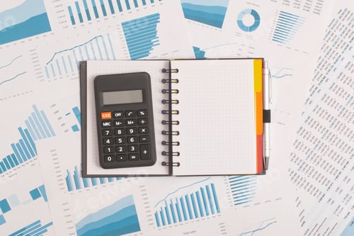 Preview: Notebook and calculator on table. Financial development, Banking Account, Statistics