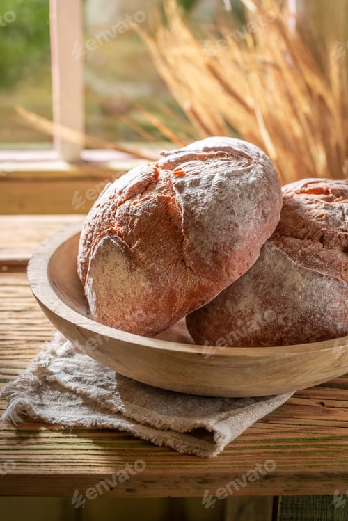 Preview: Two loaf of bread in bright spring kitchen