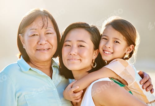 Preview: Cropped portrait of an attractive young woman on the beach with her mother and daughter