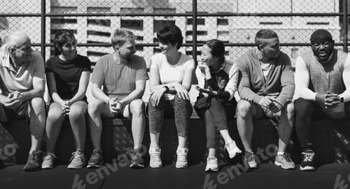 Preview: Group of diverse athletes sitting together