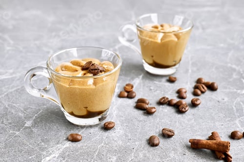 Preview: Traditional Italian dessert coffee cream in a glass cup on gray stone background.