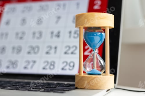 Preview: Time passing concept, time slipping away. Hourglass and the calendar