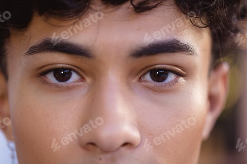 Preview: Close-up of teenage boy with focused expression, showing natural beauty