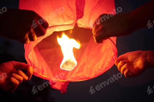 Preview: Couple Holding Sky Lantern And Launching It