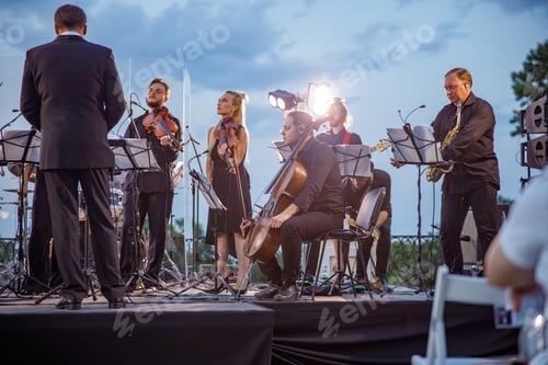 Preview: Musical ensemble giving orchestral concert on the street