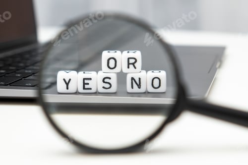 Preview: Yes or no word on cubes through a magnifying glass