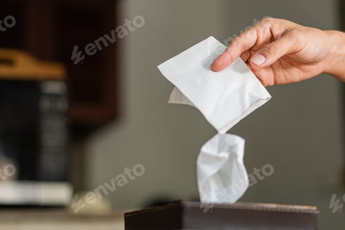 Preview: Woman taking paper tissue from box