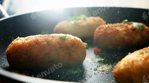 Preview: The cooking process. Stock footage. Frying meat cutlets with vegetables in hot pans.