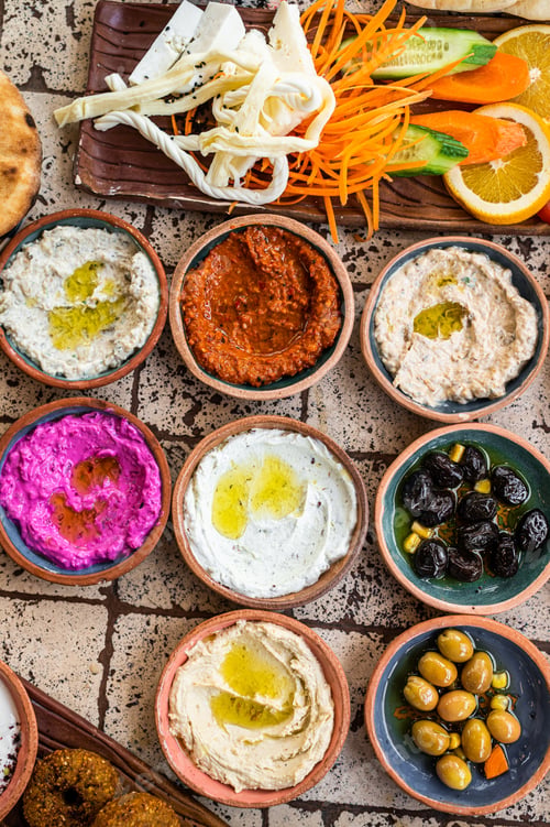 Preview: Delicious Turkish family breakfast table with pastries, vegetables, greens, spreads, cheeses