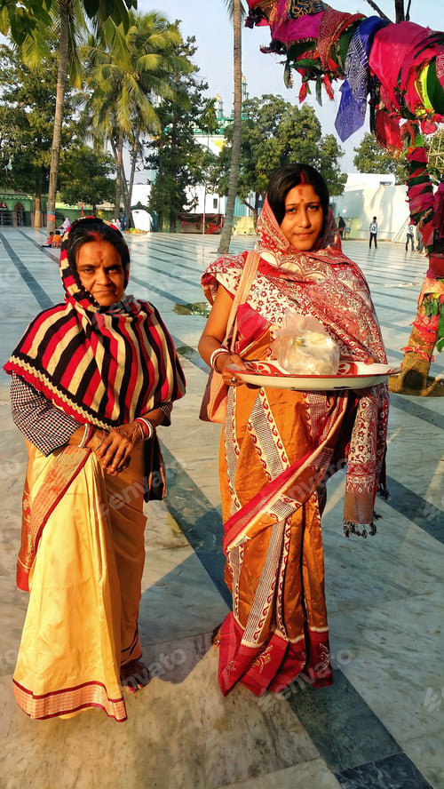 Preview: Two Indian women have come to pay homage at the shrine of Patharchapuri Data Baba..
