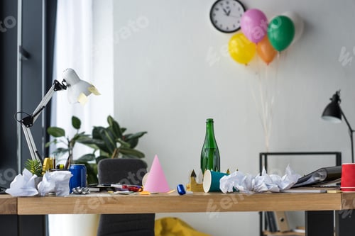 Preview: party decorations, bottle of champagne and balloons in office