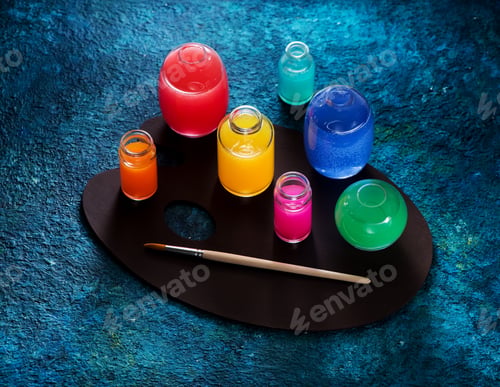 Preview: Colorful Paints on a Dark Palette with Brush