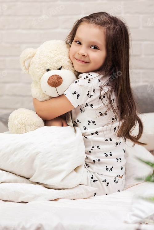 Preview: baby hugging a teddy bear