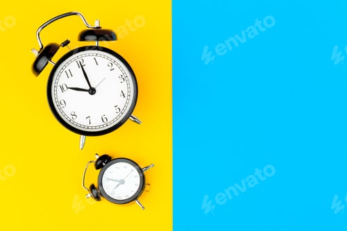 Preview: Black alarm clock on color block yellow and blue background