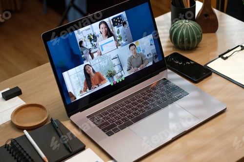Preview: close up screen groupd of asian colleage video confernece business plan with laptop on table at home